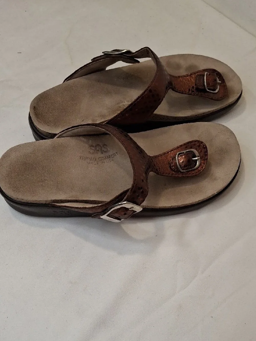 SAS Sanibel Metallic Bronze Gold Thong T Strap Sandals with Gold Buckle Detail.